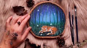 Des morceaux de bois avec des paysages peints pour un hommage à la nature