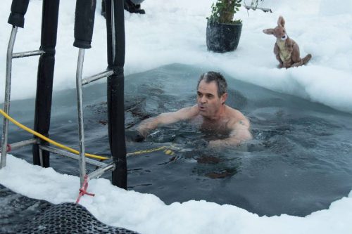 This handout photo taken on June 19, 2018 and released by the Australian Antarctic Division (AAD) on June 21 shows Barry Balkin taking a dip in a swimming hole prepared at the Casey research station as Antarctic researchers welcome the winter solstice by plunging into icy waters as part of a "mad tradition" as they look forward to brighter days after weeks of darkness. In temperatures of -22 degrees Celsius (-7.6 degrees Fahrenheit), researchers stationed at Australia's Casey base marked midwinter's day by cutting a small pool in the thick ice before stripping off and jumping in. - -----EDITORS NOTE --- ONE TIME USE --- RESTRICTED TO EDITORIAL USE - MANDATORY CREDIT "AFP PHOTO / GEORGE BRETTINGHAM-MOORE / AUSTRALIAN ANTARCTIC DIVISION" - NO MARKETING - NO ADVERTISING CAMPAIGNS - DISTRIBUTED AS A SERVICE TO CLIENTS - NO ARCHIVES TO BE USED EXCLUSIVELY FOR AFP STORY  AUSTRALIA-ANTARCTICA-SOLSTICE-WEATHER  / AFP / AUSTRALIAN ANTARCTIC DIVISION / George BRETTINGHAM-MOORE / -----EDITORS NOTE --- ONE TIME USE --- RESTRICTED TO EDITORIAL USE - MANDATORY CREDIT "AFP PHOTO / GEORGE BRETTINGHAM-MOORE / AUSTRALIAN ANTARCTIC DIVISION" - NO MARKETING - NO ADVERTISING CAMPAIGNS - DISTRIBUTED AS A SERVICE TO CLIENTS - NO ARCHIVES TO BE USED EXCLUSIVELY FOR AFP STORY  AUSTRALIA-ANTARCTICA-SOLSTICE-WEATHER